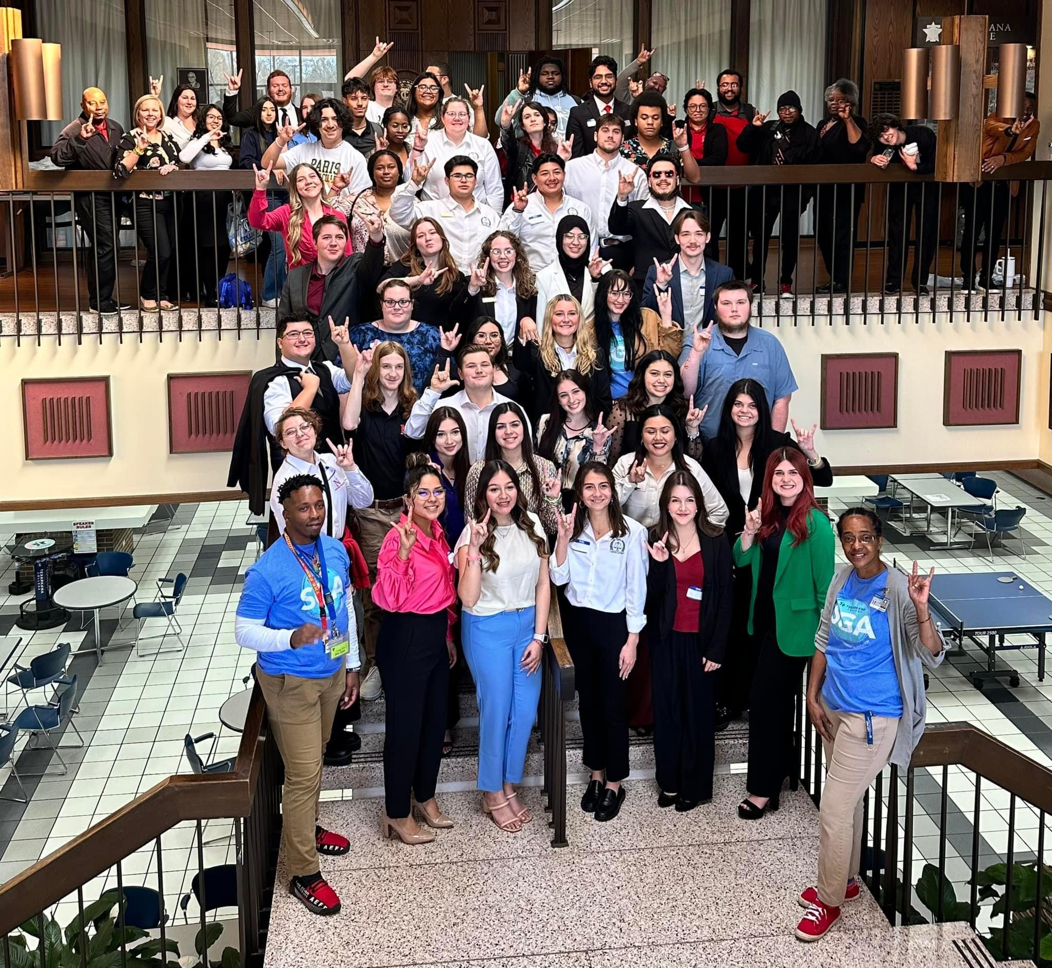 SGA Event photo with everyone posing on the student center staircase.